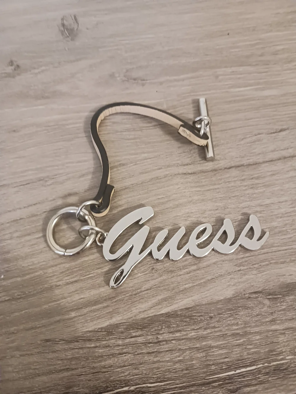 Guess Silver Script Logo Purse Charm with Toggle Leather Strap